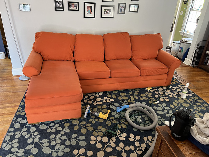 Orange couch cleaning complete at this Roanoke, VA, home. Stains removed from couch.