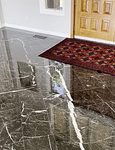 A polished black stone entryway at a home near Claytor Lake. Quest Floor Care is certified to polish and treat all types of stone, from floors to counters.