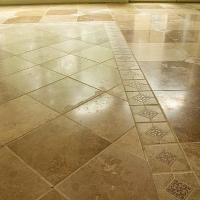 Tile floors at the lake take a beating. This tile floor is in need of professional care