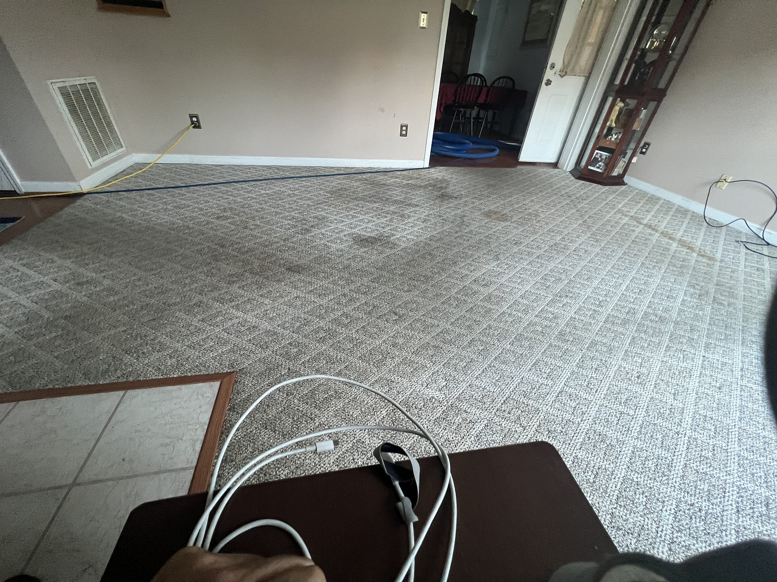 A busy family room with stained carpet in Christiansburg, VA